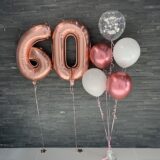 Композиция шаров с цифрами 60 в розовом золоте